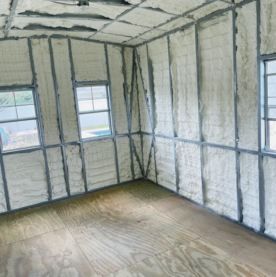 Closed-cell spray foam insulation applied to wall cavities in a residential project in Socorro